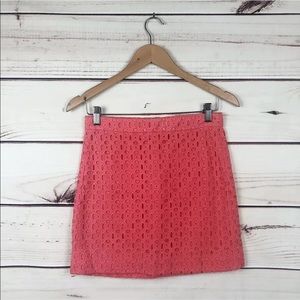 Coral eyelet mini skirt